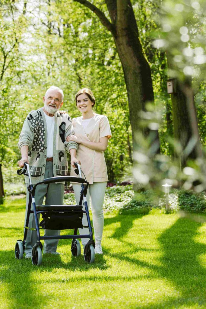 nurse and patient in the garden of modern senior care centre